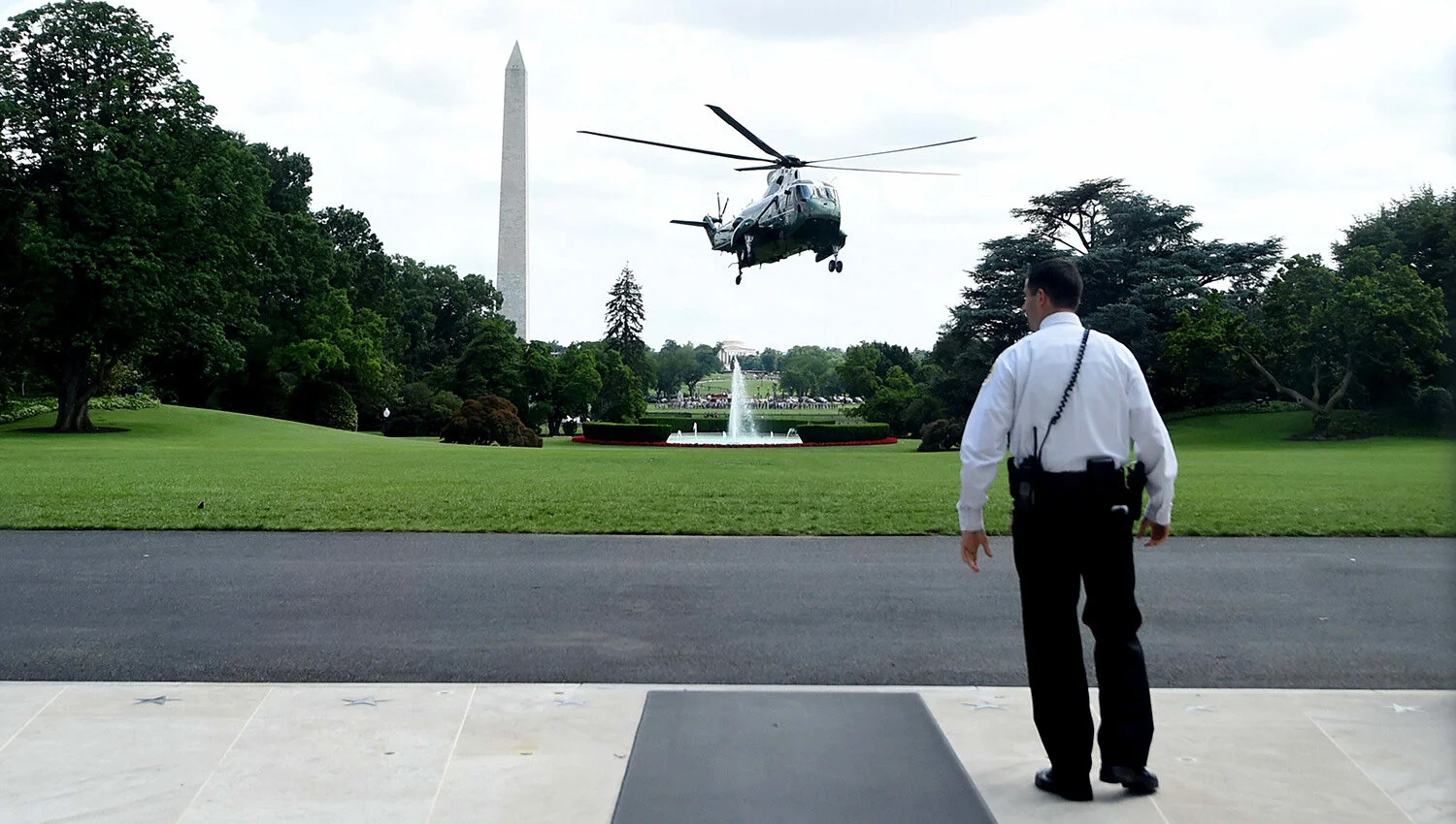 Marine one lands at the white house